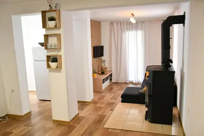 a living room with a couch and a table at Zidanica Lan in Lendava