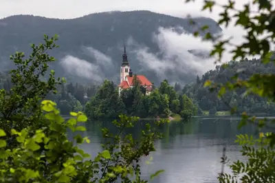 a castle on an island in the middle of a lake at Apartment in the heart of Bled with views in Bled