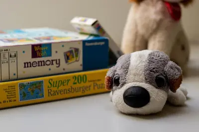 a stuffed animal is sitting next to a toy box at Apartment in the heart of Bled with views in Bled