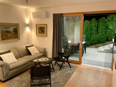 a living room with a couch and a table at Studio ELITE in Bled