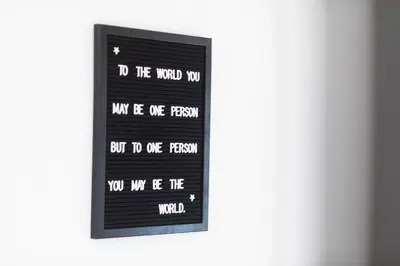 a window with the words do the world you will be one person but do one at Studio ELITE in Bled