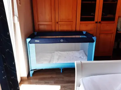a small blue bunk bed in a room at Home away from home in Bohinj