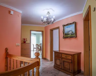 a room with a staircase and a painting on the wall at APARTMA AJDA in Komenda