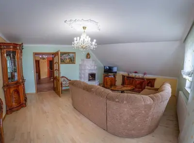 a living room with a couch and a fireplace at APARTMA AJDA in Komenda