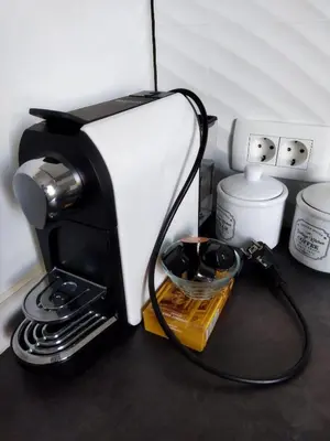 a black and white coffee maker on a counter at Apartma JERMAN - Cerknica in Cerknica