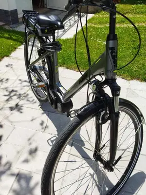 a bike is parked on a sidewalk at Apartma JERMAN - Cerknica in Cerknica