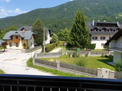 a view from the balcony of a house in a village at Apartman Irvin in Kranjska Gora