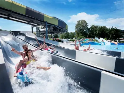 a group of people riding a water slide at a water park at Pirate Bay - Terme Čatež in Čatež ob Savi