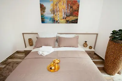 a bedroom with a bed with a donut on it at Sunny Rooms in Most na Soči