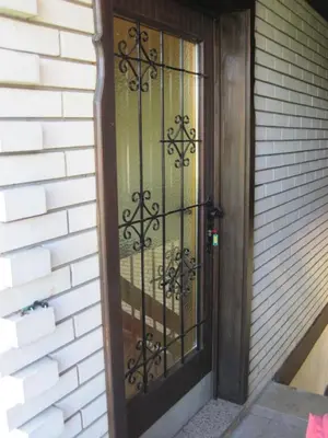 a door with a wrought iron gate on a building at edelweiss in Radovljica