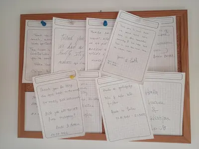 a pile of papers in a wooden frame with handwriting at edelweiss in Radovljica