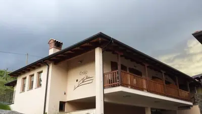 a building with a balcony on the side of it at Kraljič - Primož Čotar in Dornberk