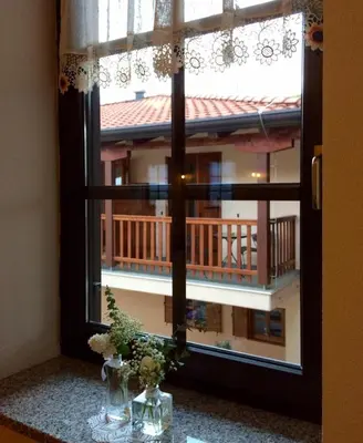 a window with a view of a balcony at Kraljič - Primož Čotar in Dornberk