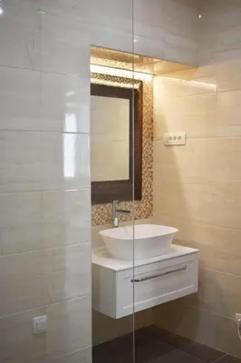 a bathroom with a white sink and a mirror at Vitez Apartment II in Ljubljana