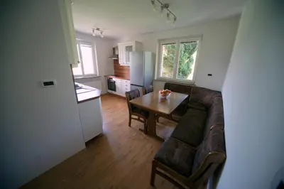 a living room with a couch and a table at Apartment Arh in Bled