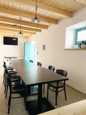 a conference room with a large table and chairs at Lagom Home Vipavski Križ in Ajdovščina