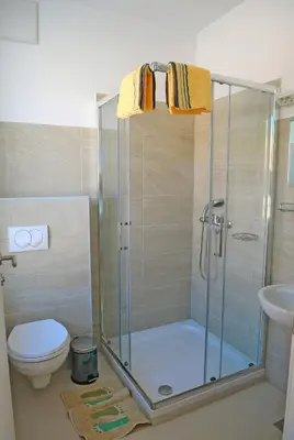 a bathroom with a shower and a toilet at Hostel Ormož in Ormoz