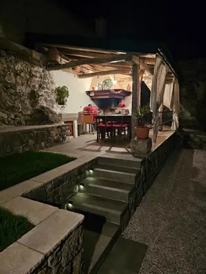 a backyard with a pool and a house with a tent at Villa Katarina in Branik