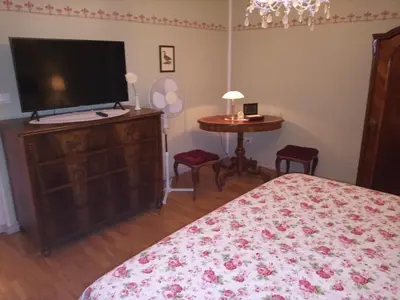 a bedroom with a bed and a flat screen tv at Villa Katarina in Branik