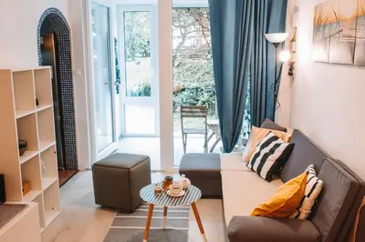 a living room with a couch and a table at Apartment with Atrium Anabela in Tolmin