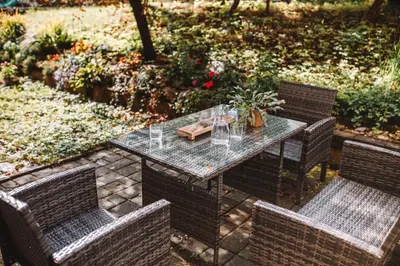 a table with two chairs and a table with glasses at Apartment with Atrium Anabela in Tolmin