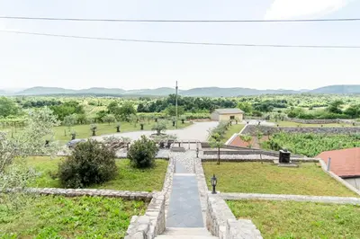 a view from the top of a hill with a road at Apartment Trieste HerMes arT in Sežana