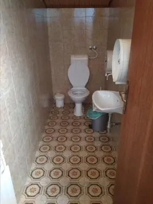 a bathroom with a toilet and a sink at Gostišče Oddih in Solkan
