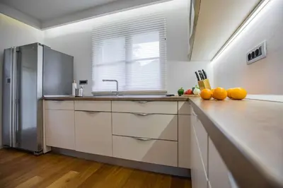 a kitchen with a sink and a refrigerator at House of Adventure - The Base to explore Slovenia in Laze v Tuhinju