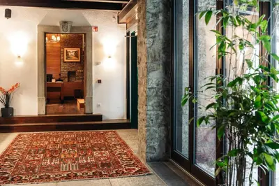 an entrance to a house with a rug on the floor at Vila Podvin in Radovljica