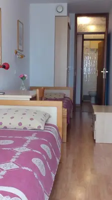 a hotel room with a bed and a bathroom at Accomodation Pertout in Nova Gorica