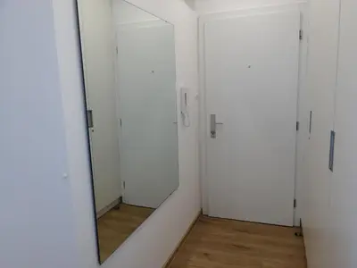 a mirror in a room with white doors at Ljubljana sky view in Ljubljana