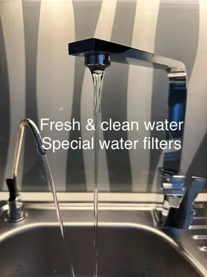 a kitchen sink with water running from a faucet at Zenja Apartments - Free Private Parking - Škocjan caves - Cozy garden in Divača