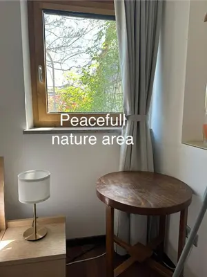 a room with a table and a window at Zenja Apartments - Free Private Parking - Škocjan caves - Cozy garden in Divača