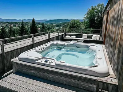 a hot tub sitting on top of a balcony at Vinica Castle Boutique & Spa Hotel in Vinica