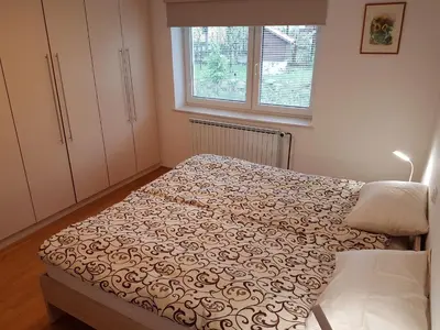 a bedroom with a bed and a window at Apartment Venko in Slovenske Konjice