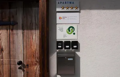 a wall with a pay station next to a door at Family fun Pohorje in Ruše