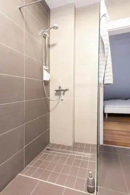 a shower with a glass door in a bathroom at Hillhouse Novo mesto in Novo Mesto