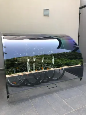 a display case with bikes in a room at Apartment VilaPark 14 in Rogaška Slatina