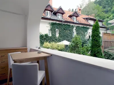 a room with a table and a view of a building at City Pearl Apartment in Ljubljana