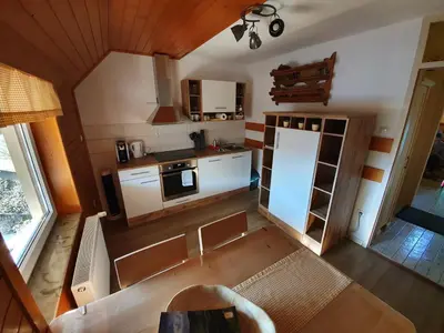 an overhead view of a kitchen with a refrigerator at Apartmaji Pavc in Bohinj