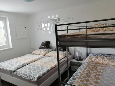 two bunk beds in a small room withthritisthritisthritisthritisthritisthritisthritisthritis at APARTMA CARNICA in Bled