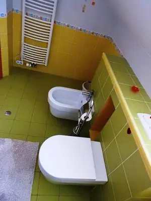 a bathroom with a toilet and a sink at Natasha's Garden House in Dol pri Ljubljani