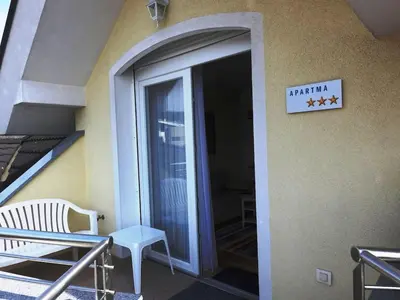 a door to a building with a sign that reads arthritis at Natasha's Garden House in Dol pri Ljubljani
