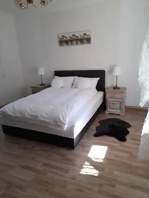 a bedroom with a large bed and two night stands at Charming house 