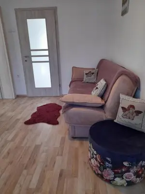 a living room with a couch and a wooden floor at Charming house 