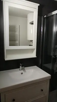 a bathroom sink with a mirror and a shower at Ajda apartment in Kranjska Gora
