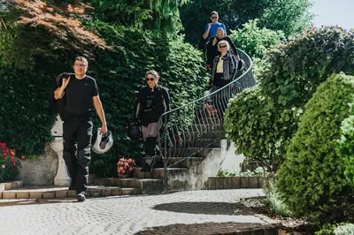 a group of people walking up some stairs at Apartmaji Urška in Laško
