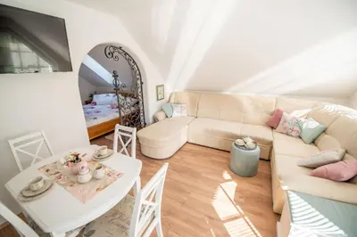 a living room with a couch and a table at Apartmaji Urška in Laško