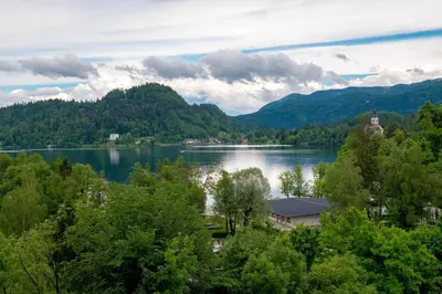 a view of a lake in the middle of a forest at Gorgeous Chalet in Bled