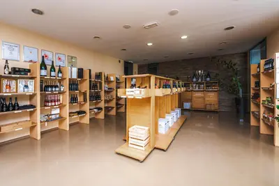 a wine store with shelves of wine bottles at POHORJE HOUSE Rogla 2 in Oplotnica